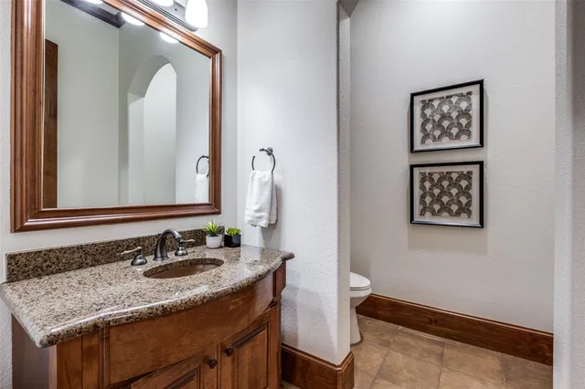 a bathroom with a sink vanity and a mirror