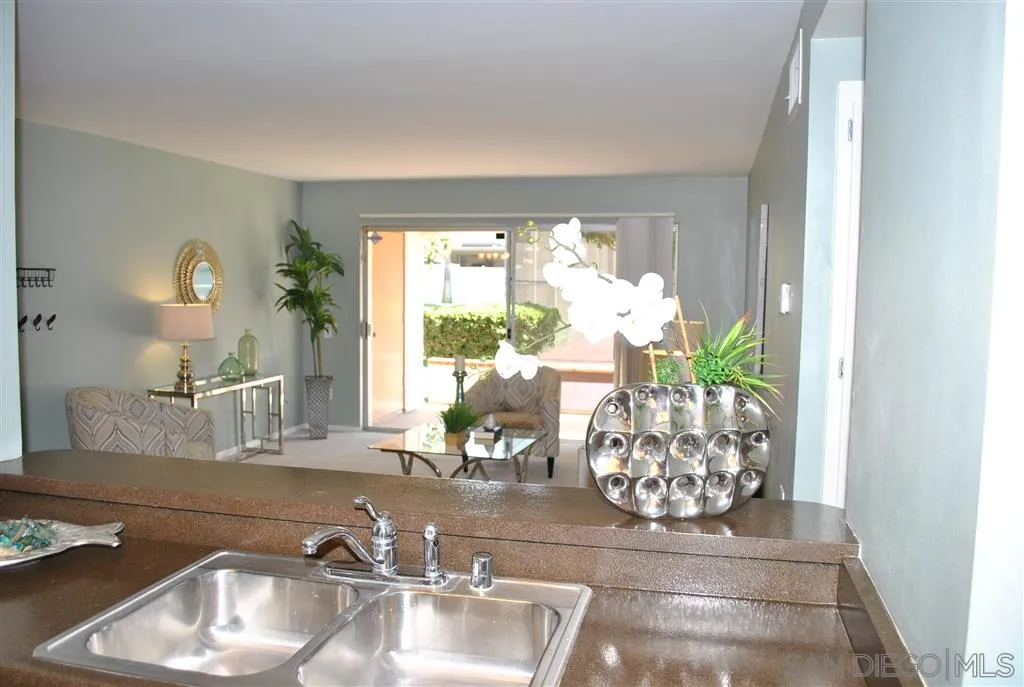 5999 Rancho Mission Road San Diego, CA 92108 - Photo 19 of 25 a room with a large window and dining table