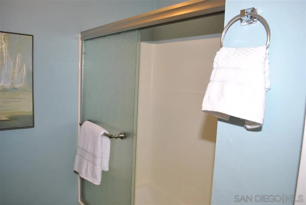 5999 Rancho Mission Road San Diego, CA 92108 - Photo 8 of 25 a bathroom with a sink and mirror