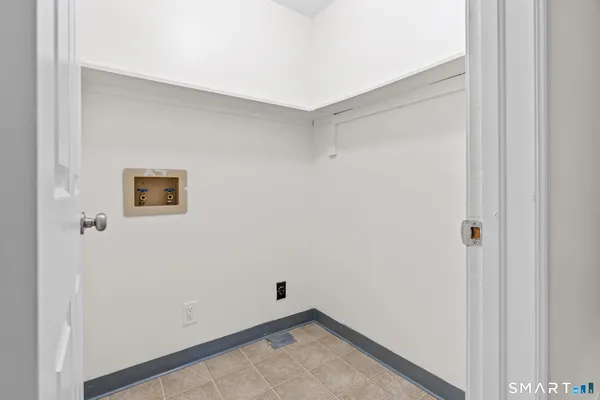 a view of a small space with wooden floor