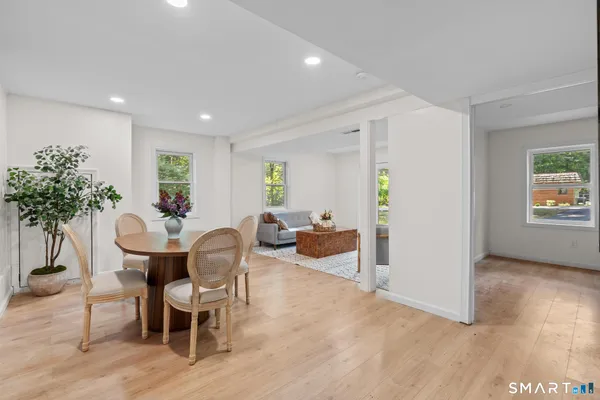 a view of a livingroom with furniture and a potted plant