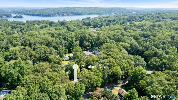 an aerial view of a houses with a yard