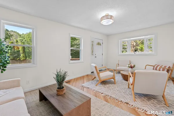 a living room with furniture and a window