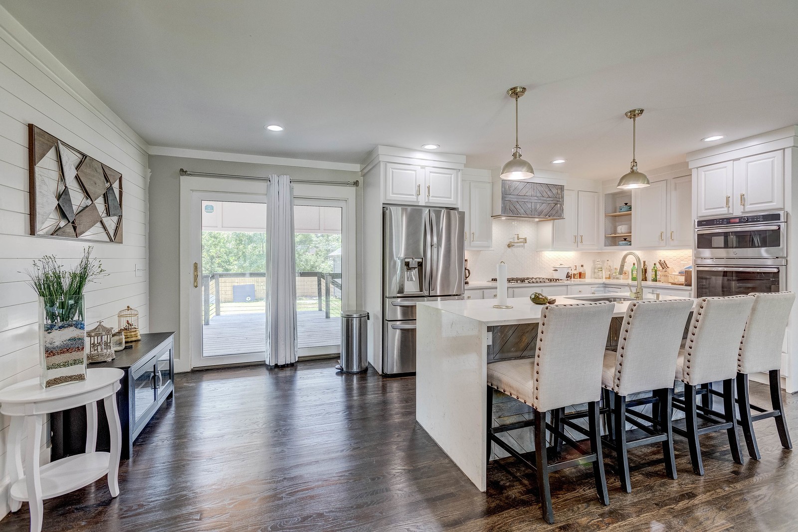 490 Rural Hill Road Nashville, TN 37217 - Photo 11 of 36 a dining room with stainless steel appliances kitchen island granite countertop a dining table chairs and white cabinets