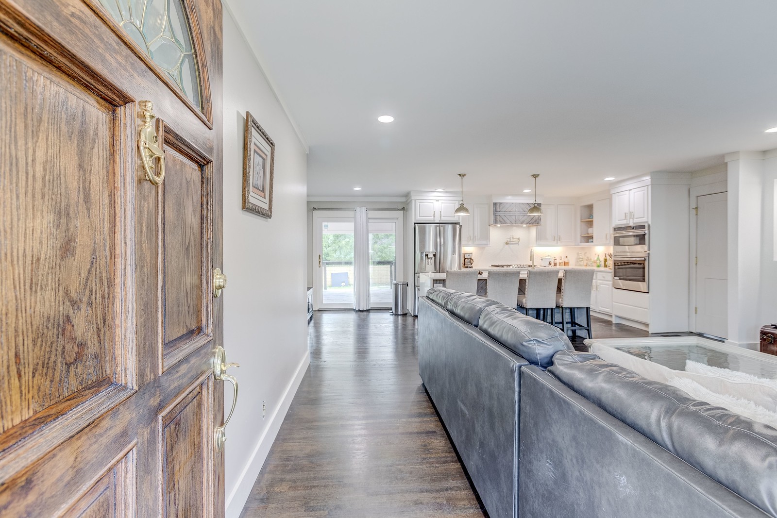 490 Rural Hill Road Nashville, TN 37217 - Photo 5 of 36 a large white kitchen with a large window and stainless steel appliances