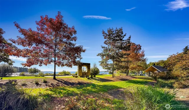 a view of a lake with a table and chairs