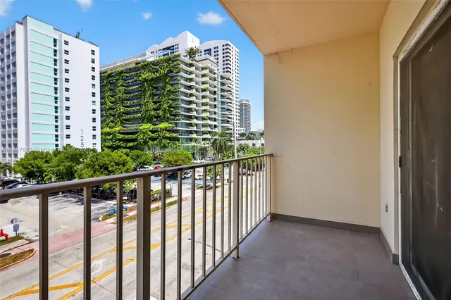 a view of balcony with a potted plant