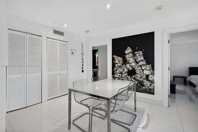 a view of a livingroom with furniture and bathroom view