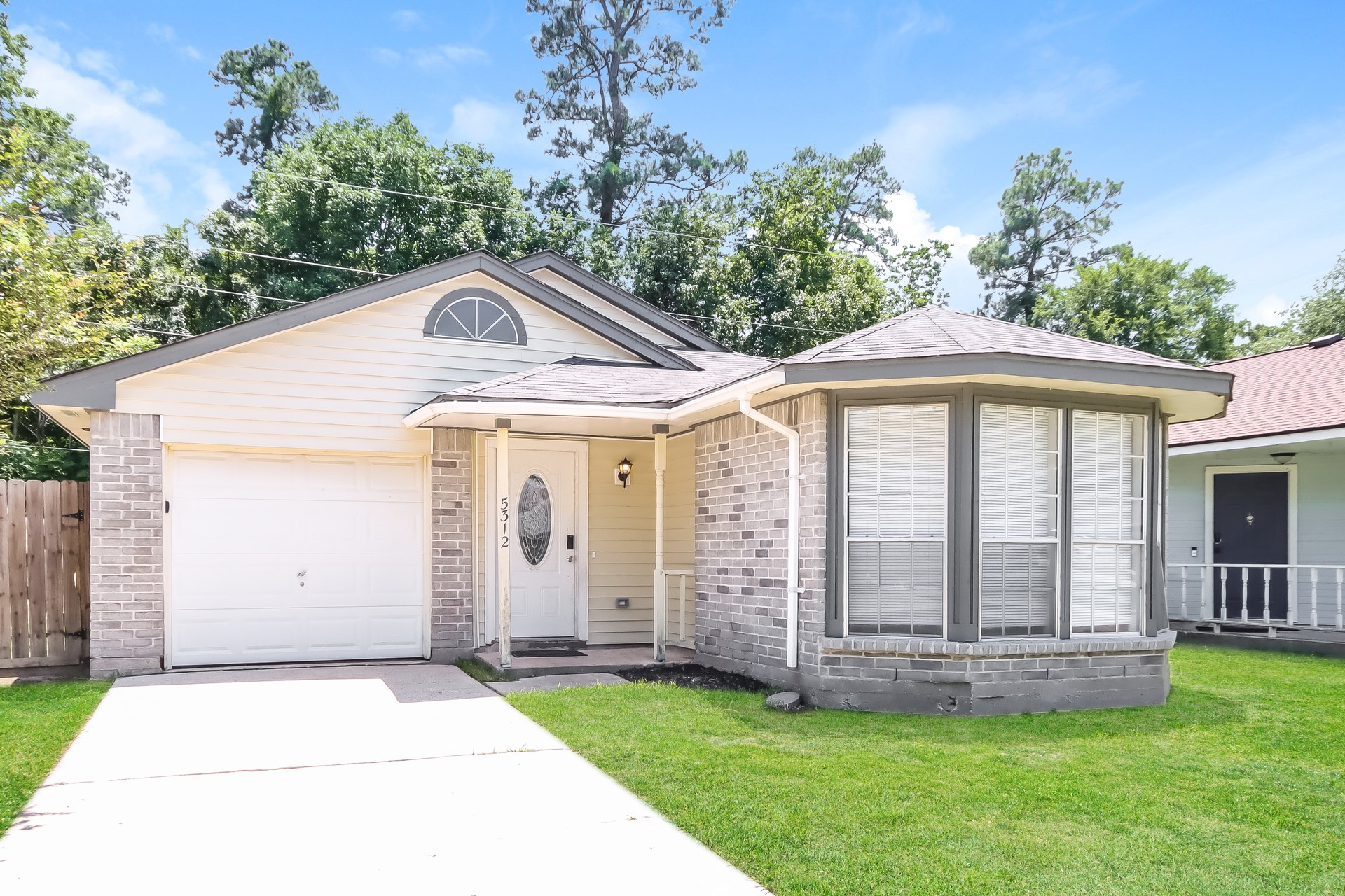 5312 Lynngate Drive Spring, TX 77373 - Photo 2 of 16 a front view of a house with a garden