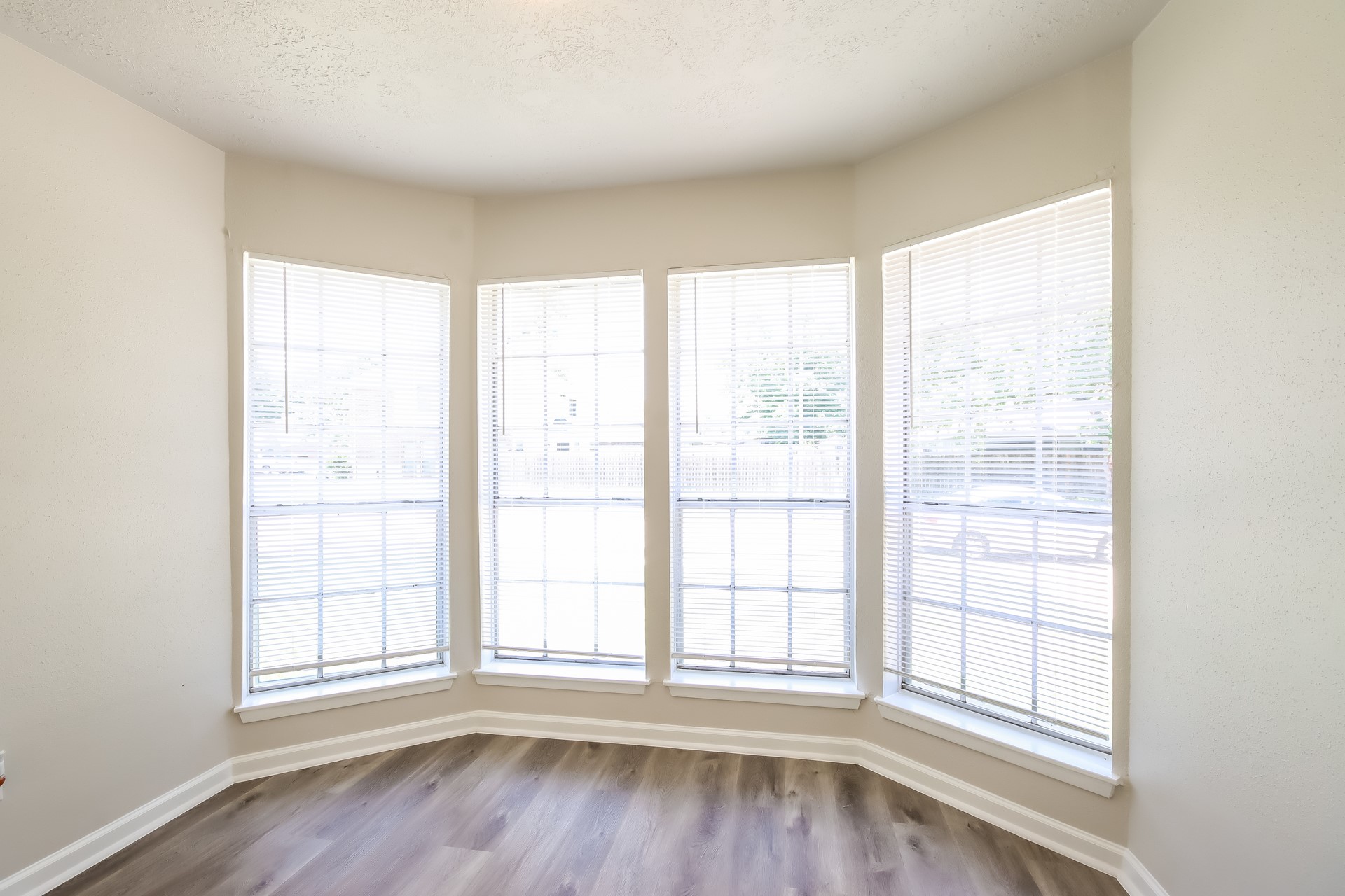 5312 Lynngate Drive Spring, TX 77373 - Photo 5 of 16 an empty room with wooden floor and windows