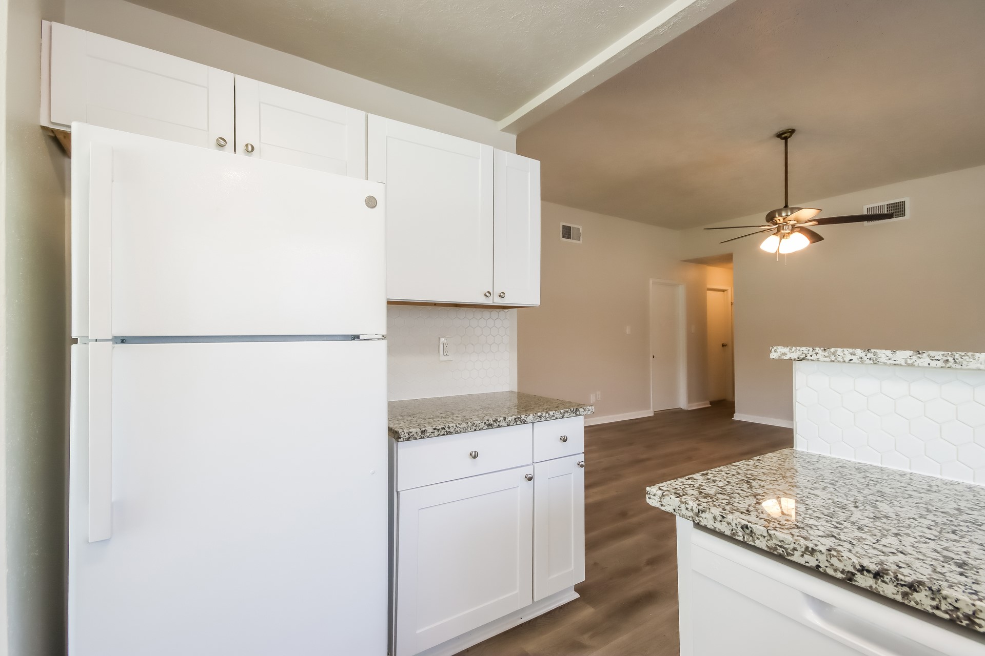 5312 Lynngate Drive Spring, TX 77373 - Photo 7 of 16 a kitchen with a refrigerator and a sink