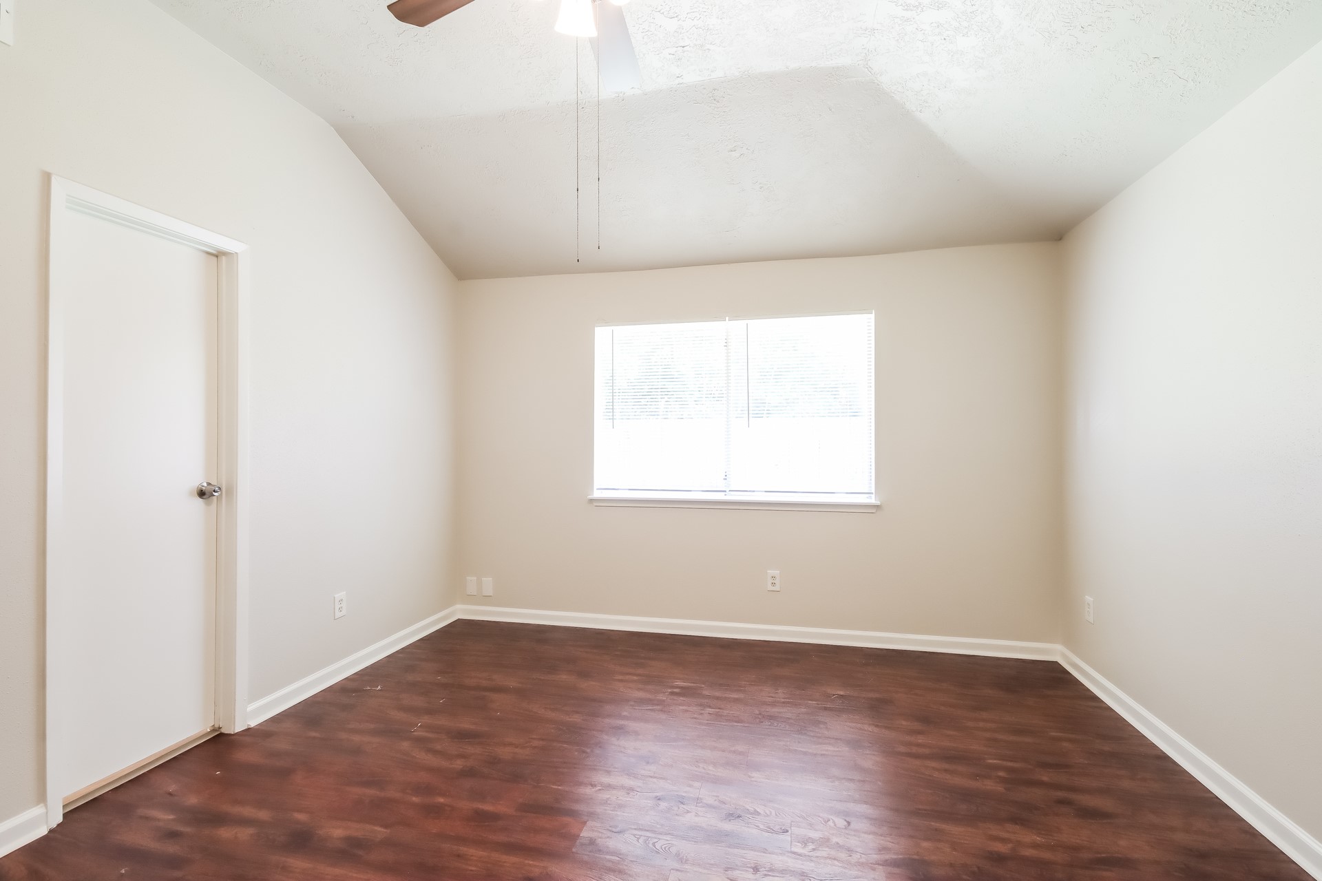 5312 Lynngate Drive Spring, TX 77373 - Photo 8 of 16 an empty room with wooden floor and windows