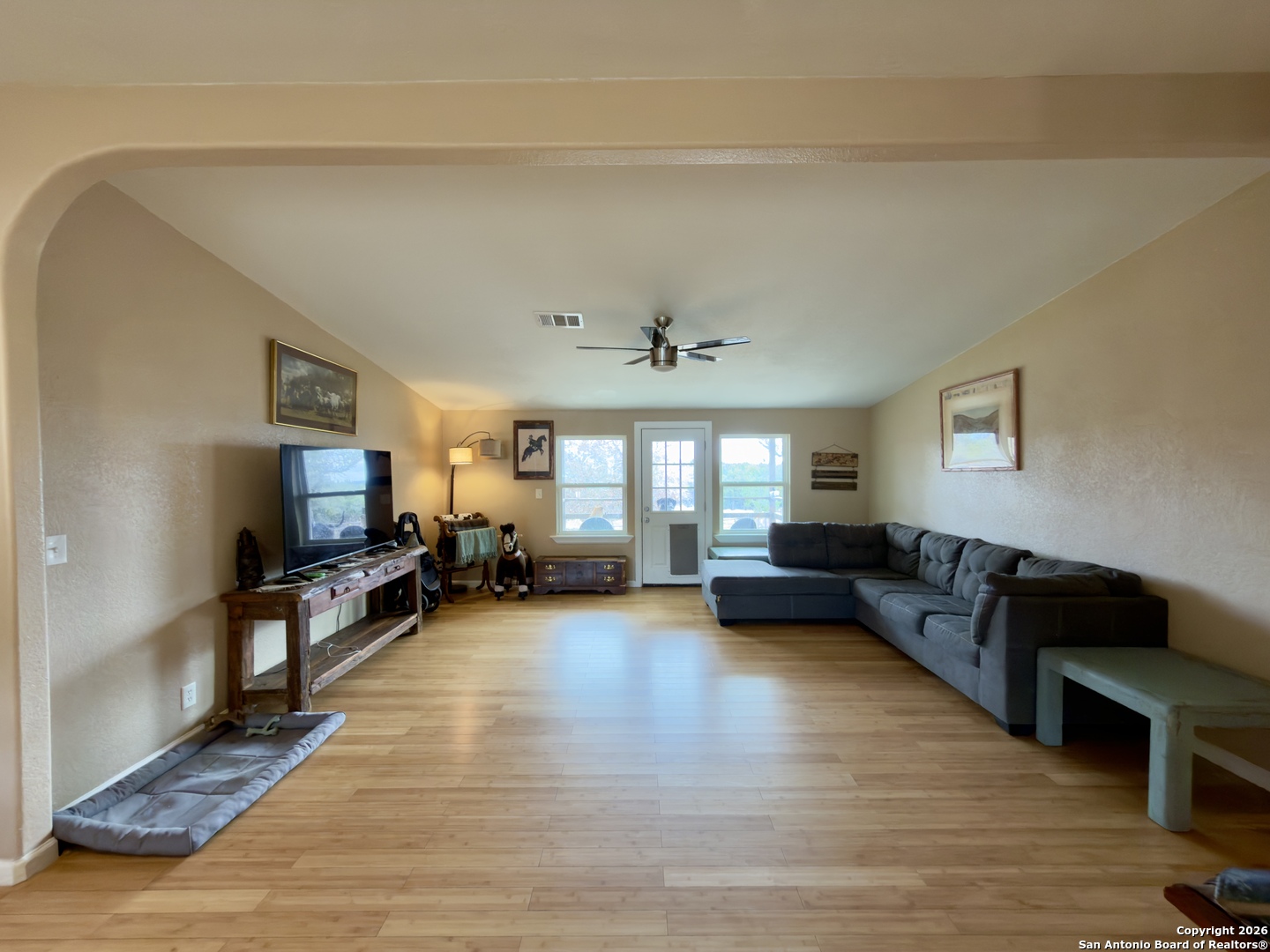 946 Frontier Lane Bandera, TX 78003 - Photo 13 of 49 a living room with furniture and a flat screen tv