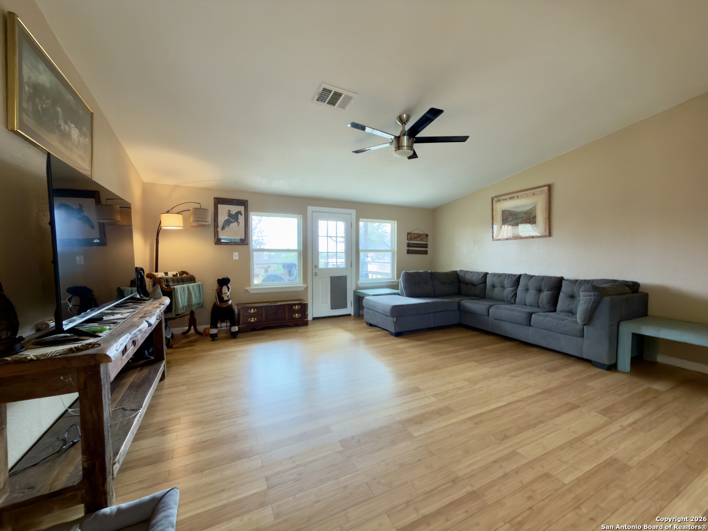 946 Frontier Lane Bandera, TX 78003 - Photo 14 of 49 a living room with furniture and a flat screen tv