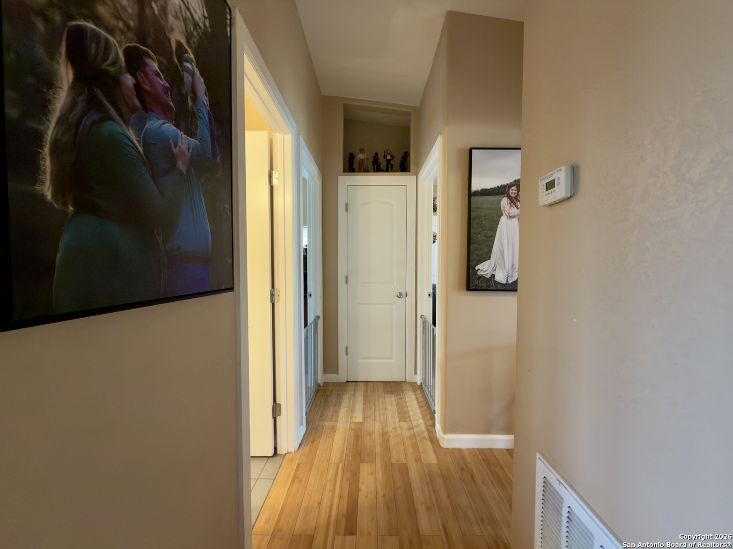 946 Frontier Lane Bandera, TX 78003 - Photo 15 of 49 a view of a hallway with wooden floor and closet