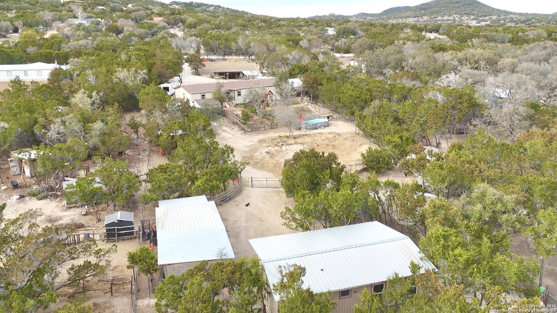 946 Frontier Lane Bandera, TX 78003 - Photo 2 of 49 an aerial view of residential houses with outdoor space