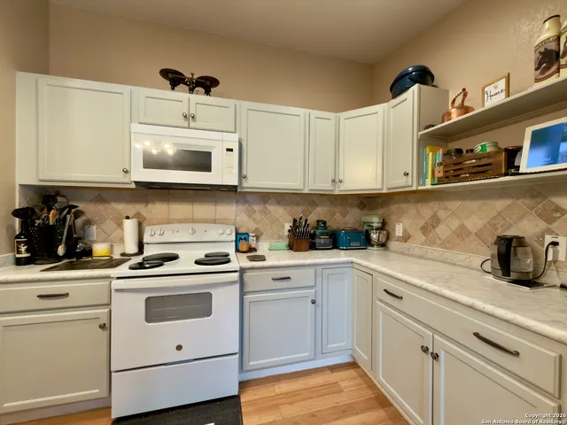 a large kitchen with cabinets
