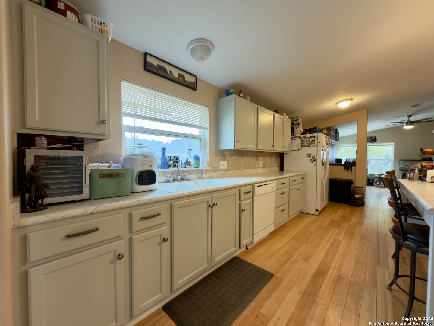 946 Frontier Lane Bandera, TX 78003 - Photo 25 of 48 a large kitchen with cabinets