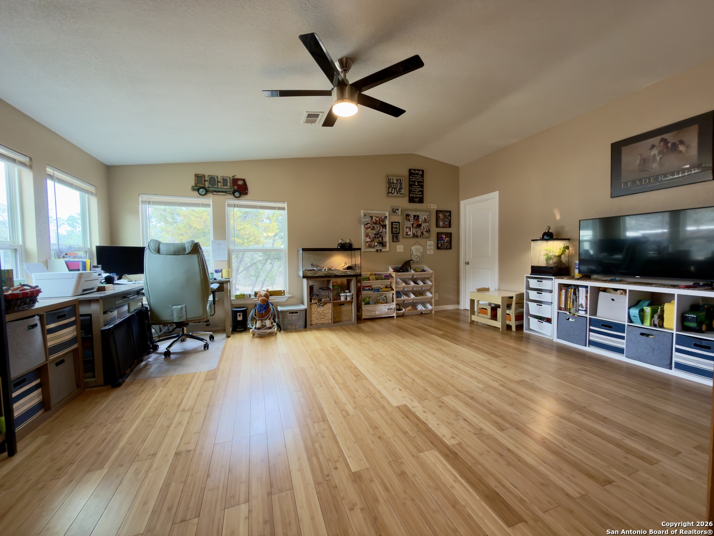 946 Frontier Lane Bandera, TX 78003 - Photo 27 of 49 a living room with furniture and a flat screen tv