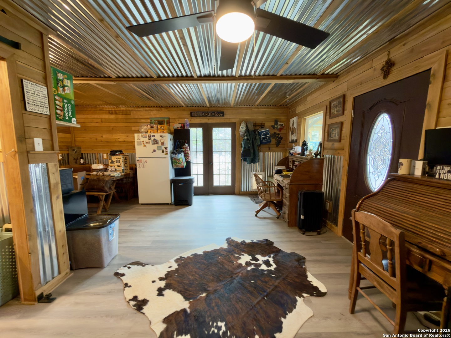 946 Frontier Lane Bandera, TX 78003 - Photo 32 of 48 a view of a livingroom with furniture and a garage