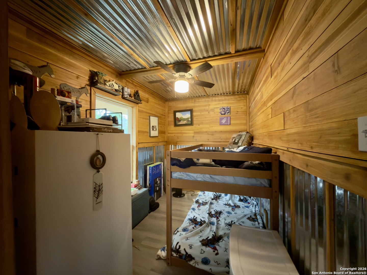 946 Frontier Lane Bandera, TX 78003 - Photo 38 of 49 a view of water heater room with refrigerator