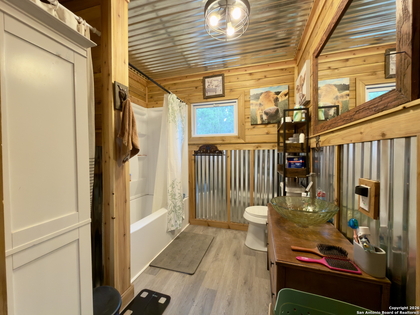 946 Frontier Lane Bandera, TX 78003 - Photo 39 of 49 a view of a porch with a door and wooden floor