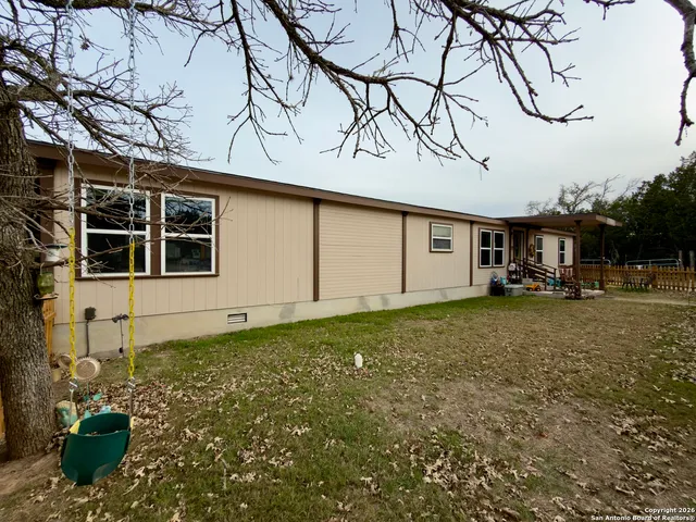 a table and chairs in front of a house