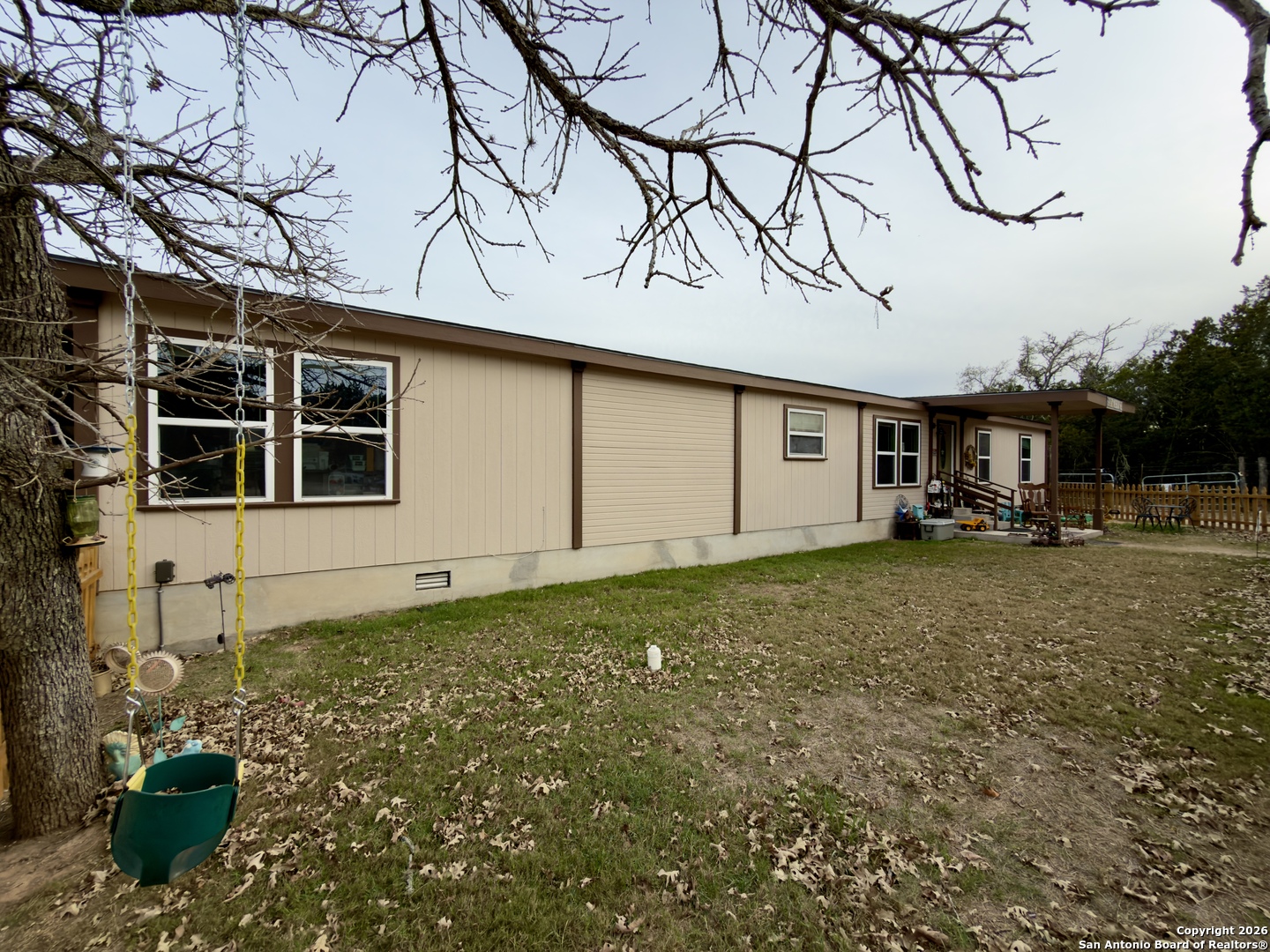 946 Frontier Lane Bandera, TX 78003 - Photo 8 of 49 a backyard of a house with lots of green space