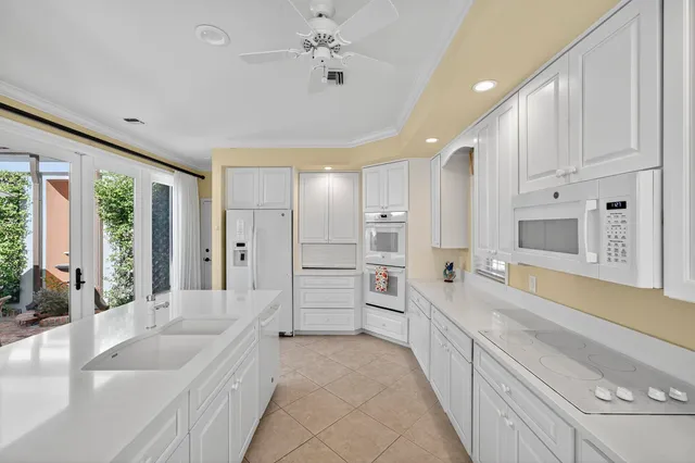 a kitchen with a refrigerator and cabinets