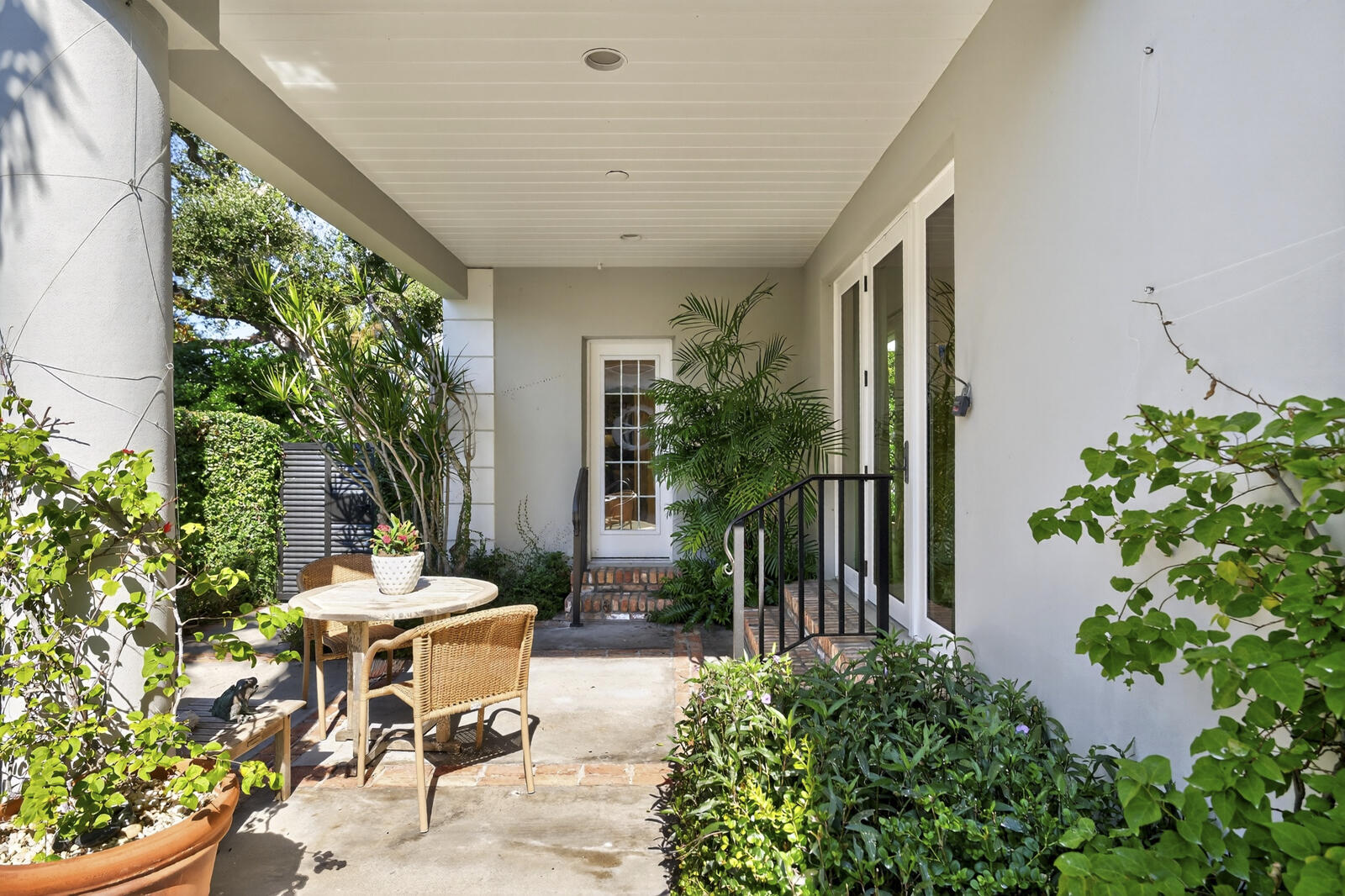 625 Riomar Drive Vero Beach, FL 32963 - Photo 34 of 54 a view of a patio with table and chairs potted plants with wooden fence