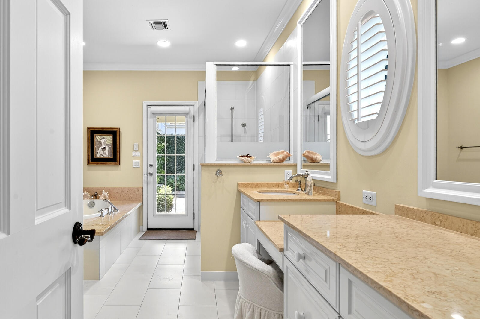 625 Riomar Drive Vero Beach, FL 32963 - Photo 39 of 54 a spacious bathroom with a granite countertop sink mirror and bathtub