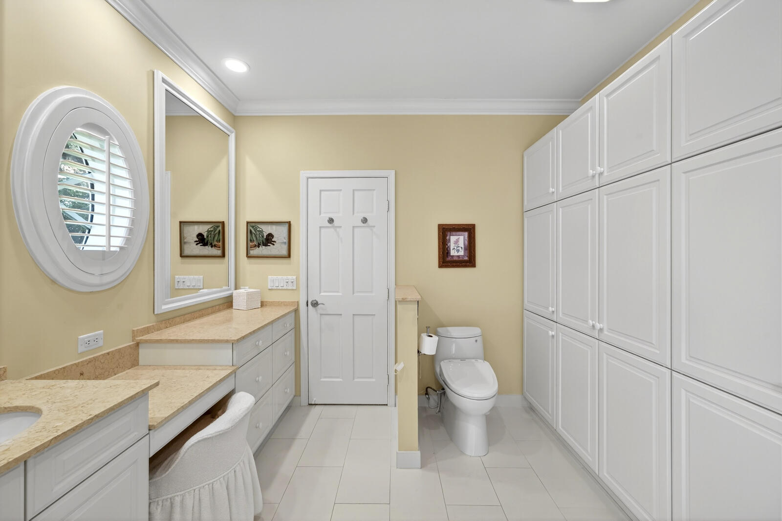 625 Riomar Drive Vero Beach, FL 32963 - Photo 40 of 54 a spacious bathroom with a granite countertop toilet a sink and a mirror