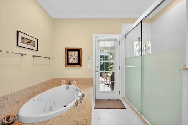 a spacious bathroom with a double vanity sink toilet mirror and shower