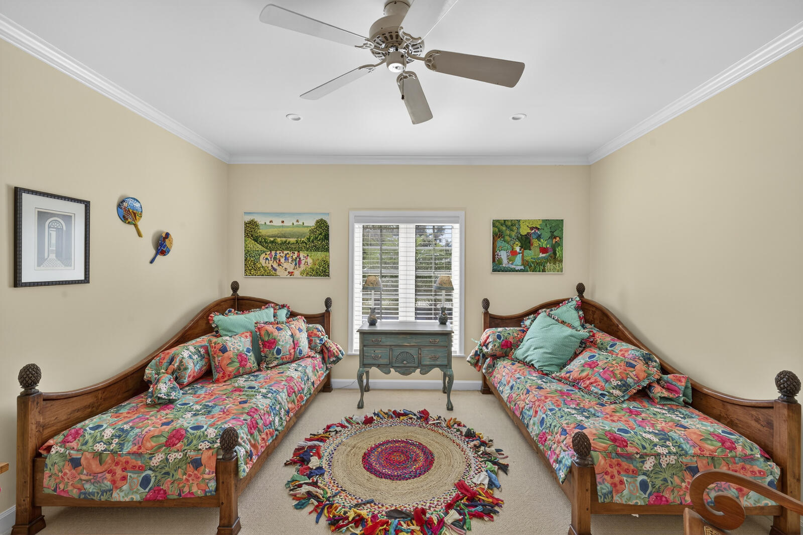 625 Riomar Drive Vero Beach, FL 32963 - Photo 44 of 54 a bedroom with three beds and a chandelier