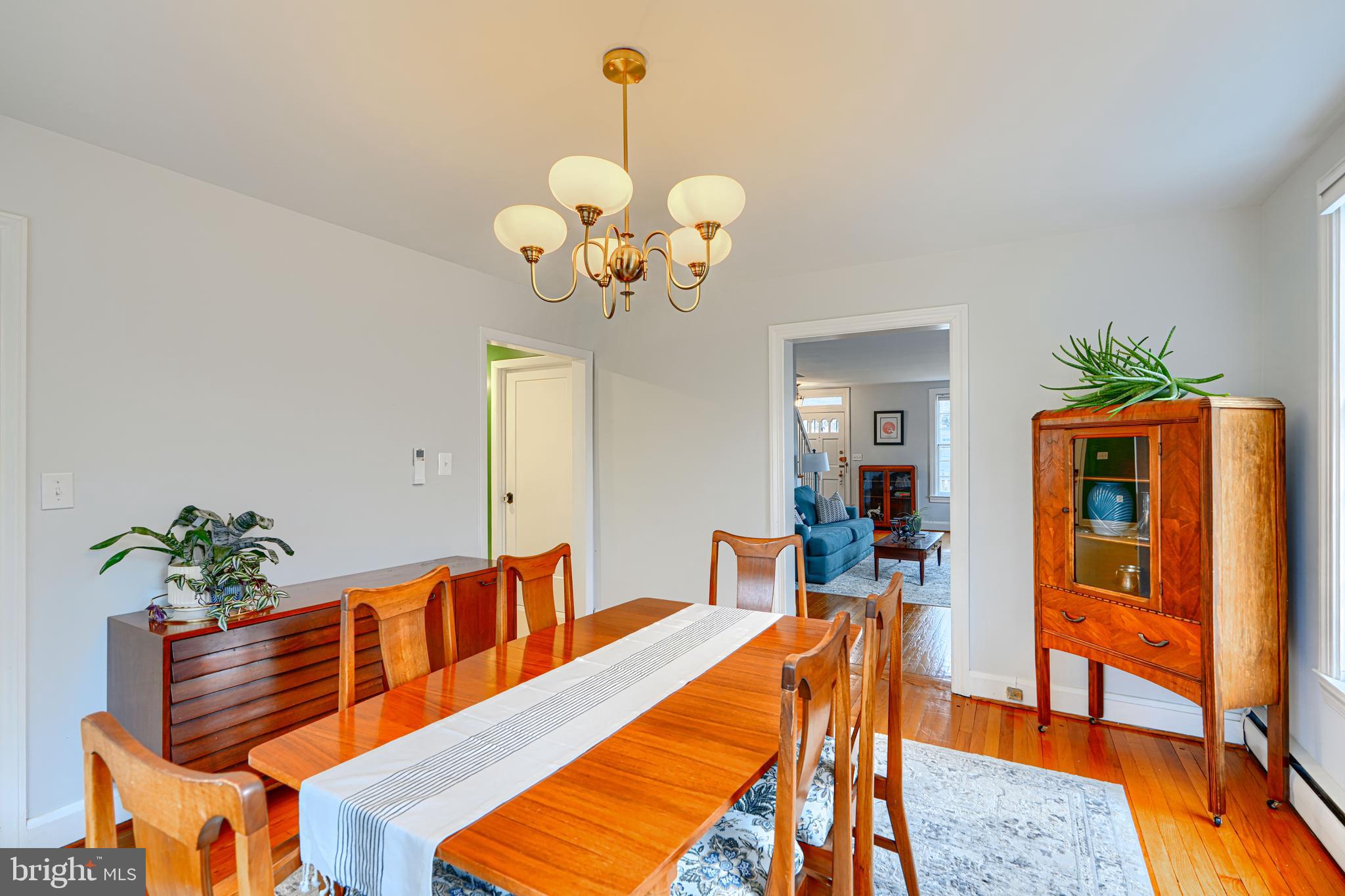 5000 Greenleaf Road Baltimore, MD 21210 - Photo 11 of 45 a dining room filled chandelier and wooden floor