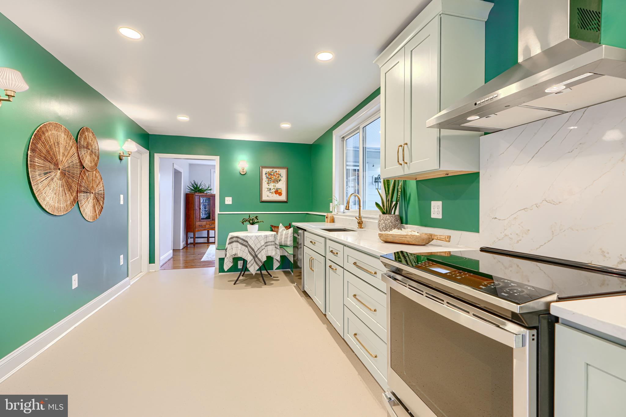 5000 Greenleaf Road Baltimore, MD 21210 - Photo 13 of 45 a kitchen with stainless steel appliances granite countertop a sink and a stove