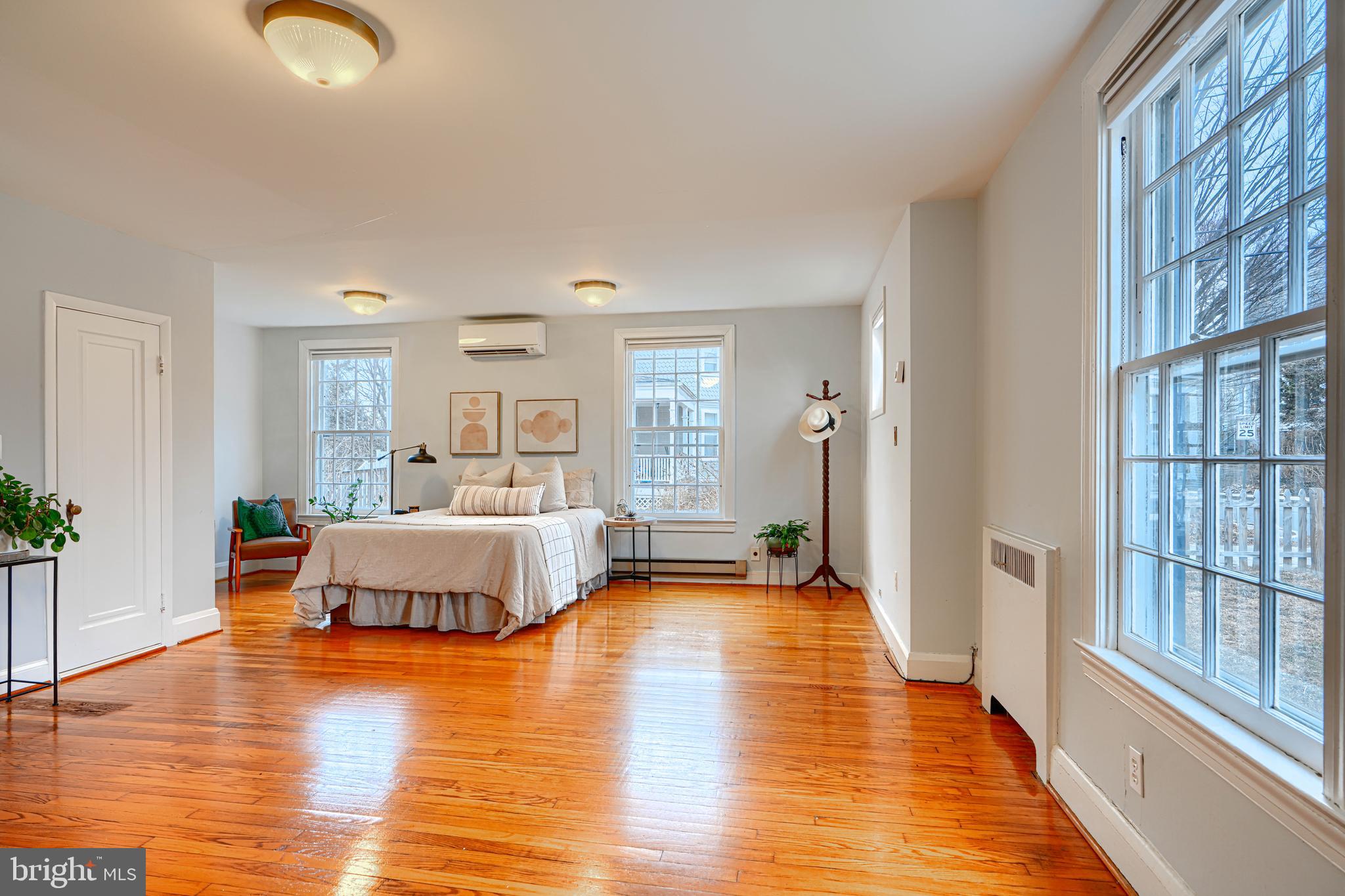 5000 Greenleaf Road Baltimore, MD 21210 - Photo 17 of 45 a spacious bedroom with a bed and a large window