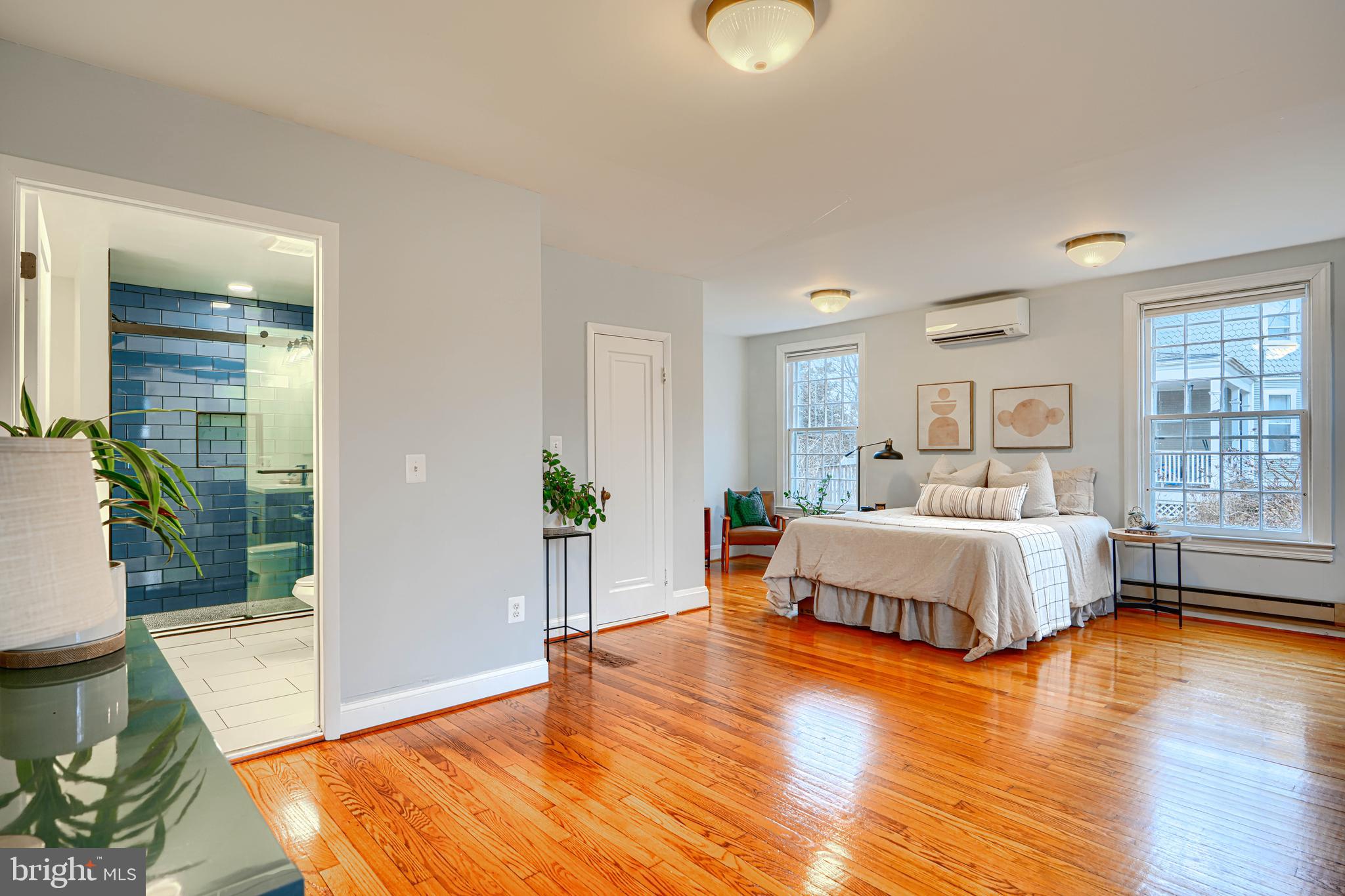 5000 Greenleaf Road Baltimore, MD 21210 - Photo 20 of 45 a spacious bedroom with a large bed and a wooden floor