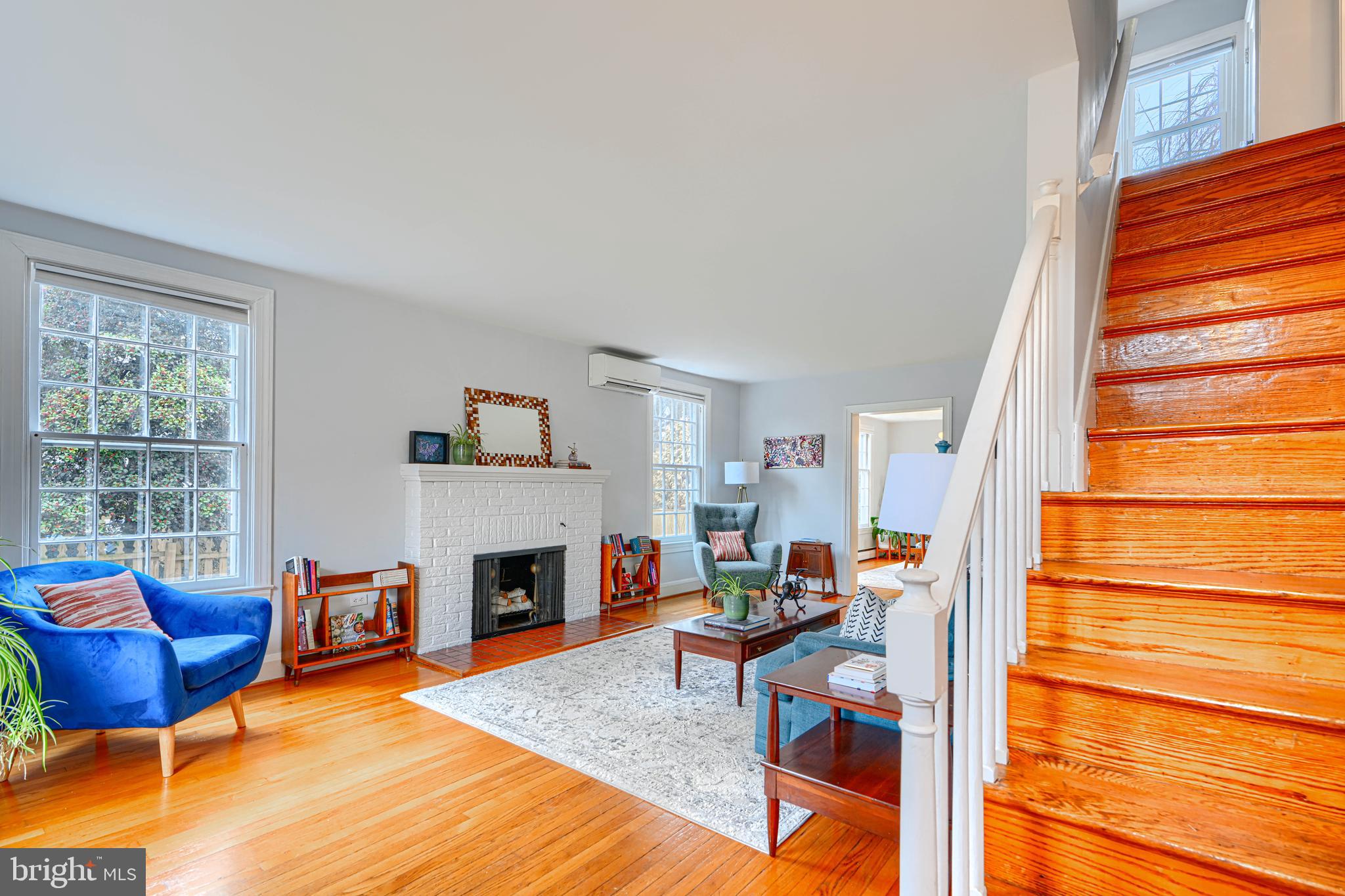 5000 Greenleaf Road Baltimore, MD 21210 - Photo 24 of 45 a living room with furniture a fireplace and a flat screen tv