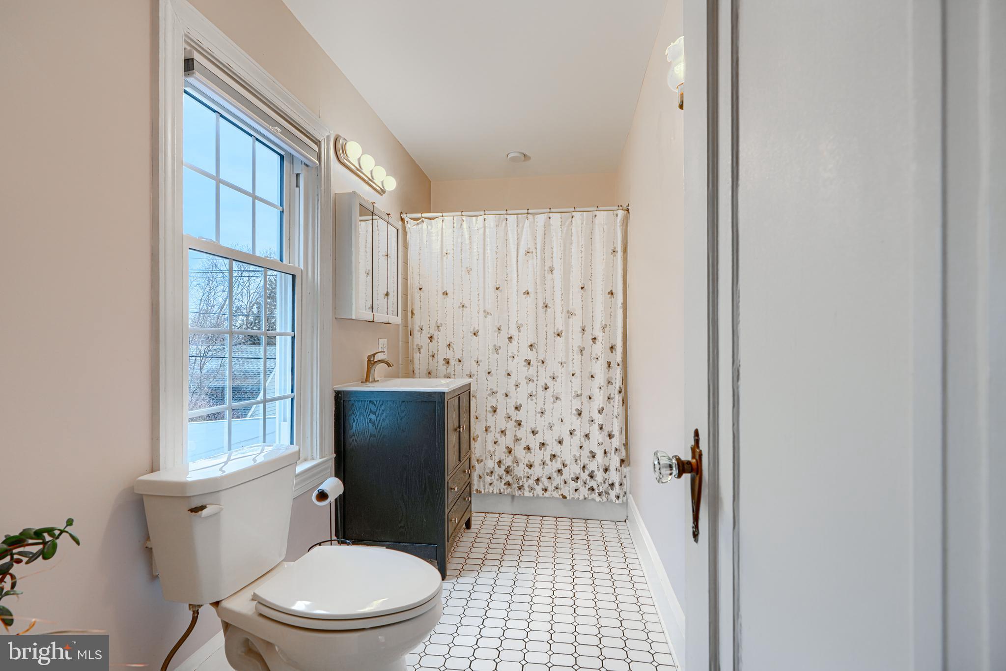 5000 Greenleaf Road Baltimore, MD 21210 - Photo 29 of 45 a bathroom with a toilet and a shower