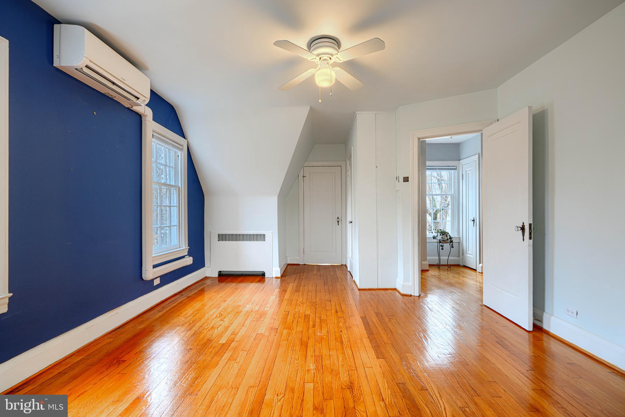 5000 Greenleaf Road Baltimore, MD 21210 - Photo 33 of 45 a view of an empty room with wooden floor and a ceiling fan