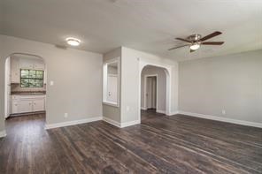 4934 Perry Street Houston, TX 77021 - Photo 2 of 9 wooden floor in an empty room with a window