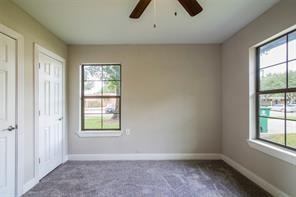 4934 Perry Street Houston, TX 77021 - Photo 6 of 9 an empty room with windows and closet