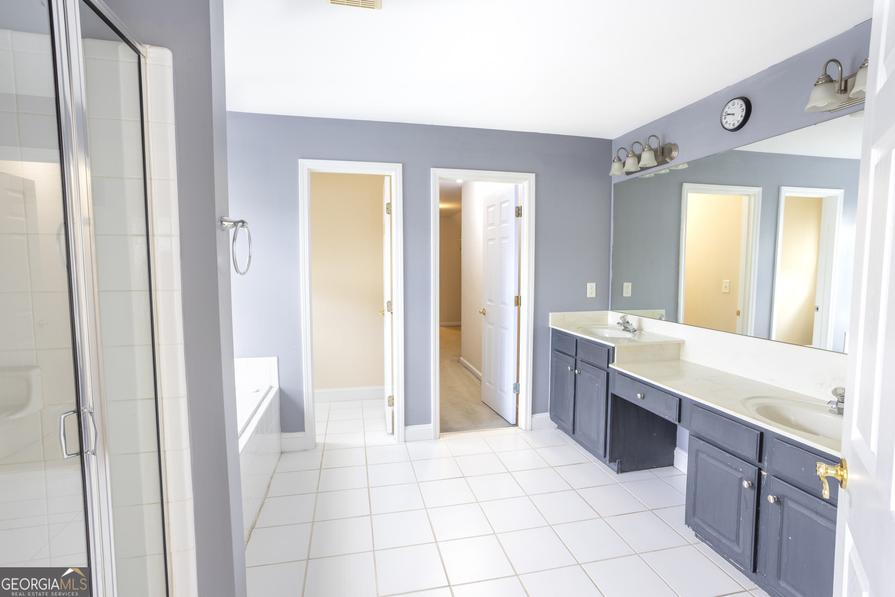 1031 Jordan Road Dacula, GA 30019 - Photo 14 of 35 a large bathroom with a sink a mirror and a bathtub