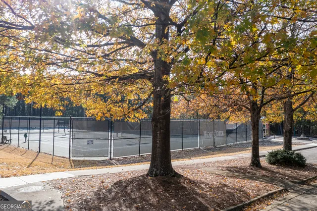 a backyard of a house with lots of tree