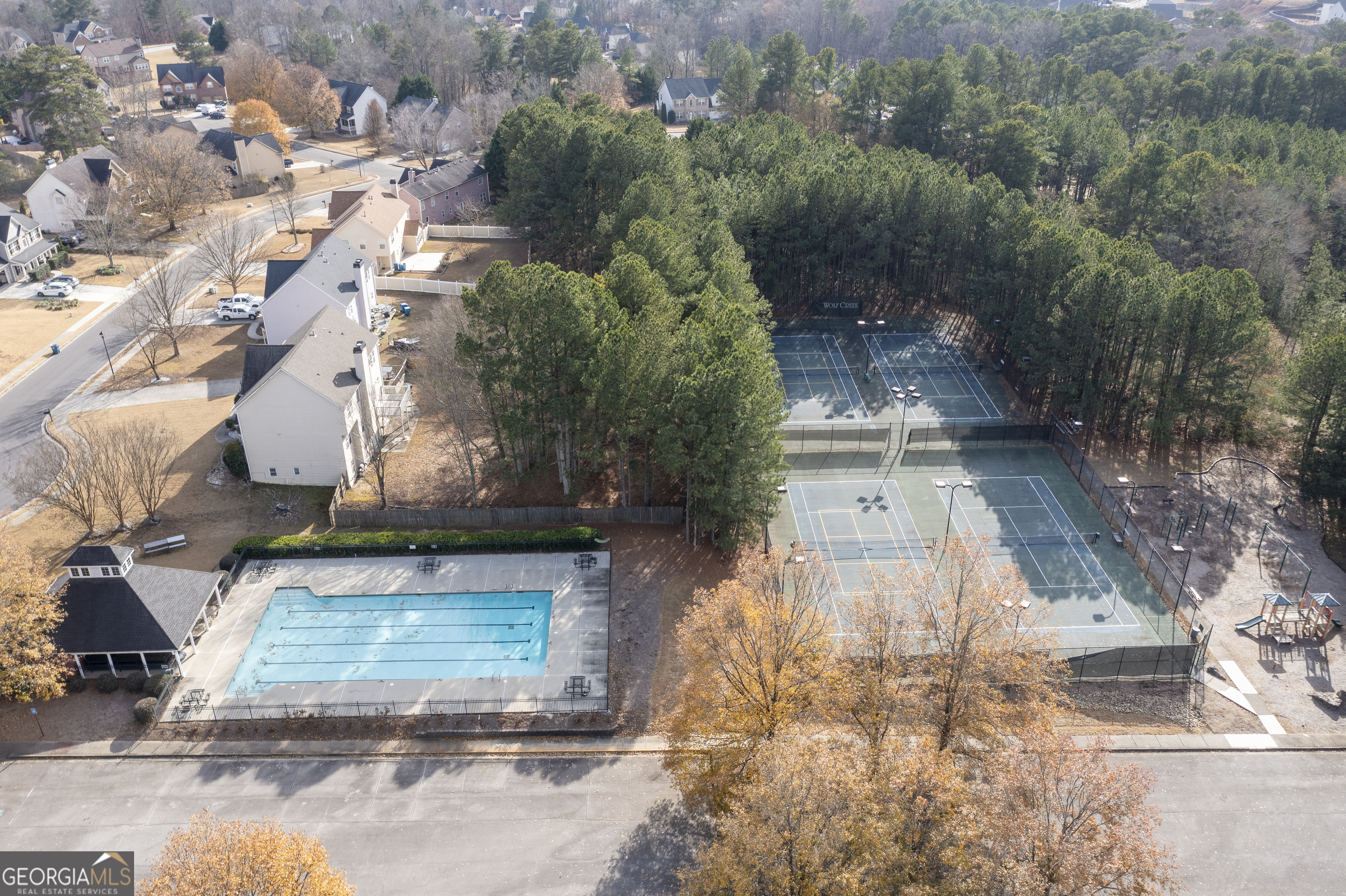 1031 Jordan Road Dacula, GA 30019 - Photo 27 of 35 an aerial view of a house with a yard and large tree