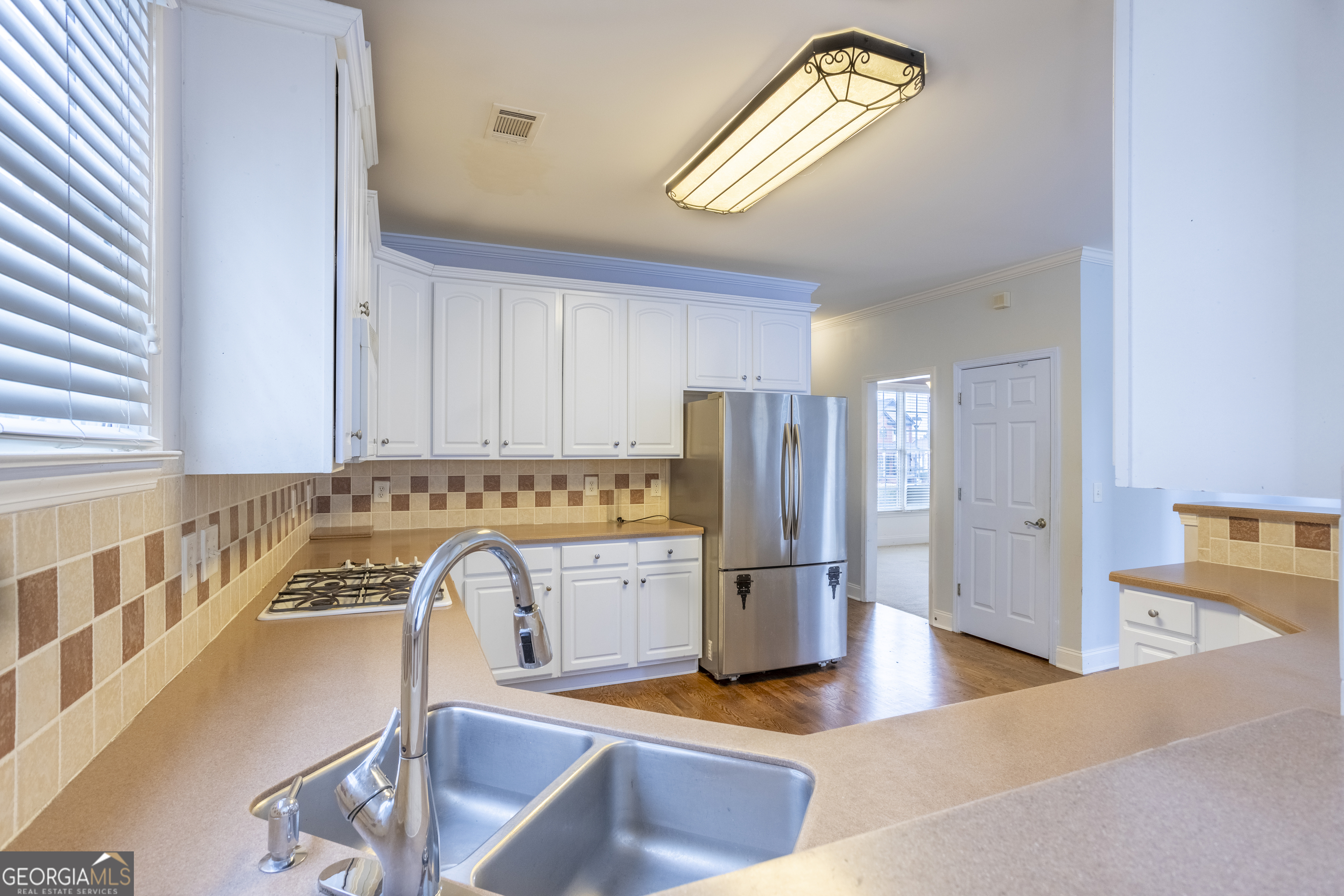 1031 Jordan Road Dacula, GA 30019 - Photo 7 of 35 a view of kitchen with refrigerator stove and a sink