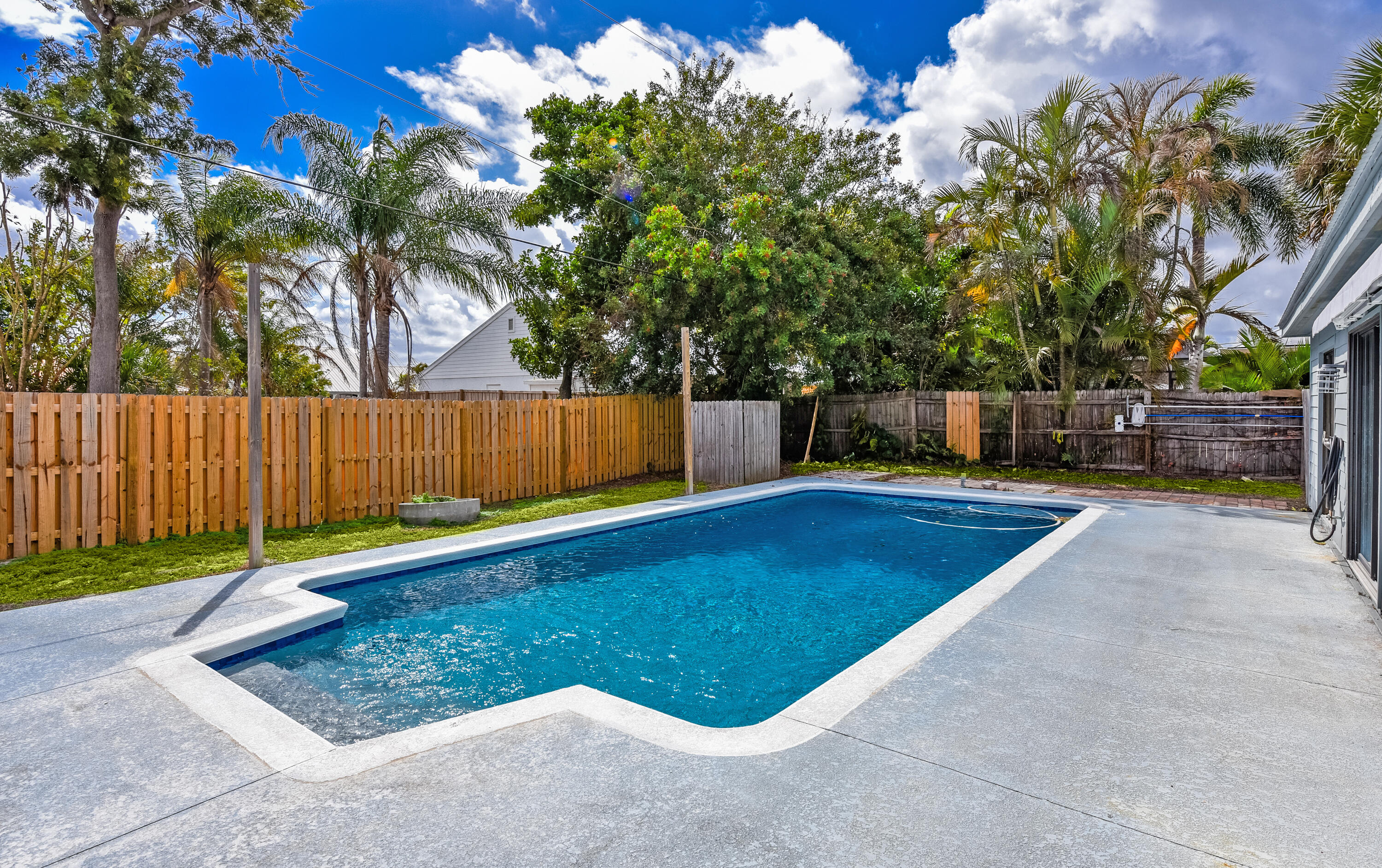 5666 Southeast Matousek Street Stuart, FL 34997 - Photo 25 of 49 Access to pool from main and guest house