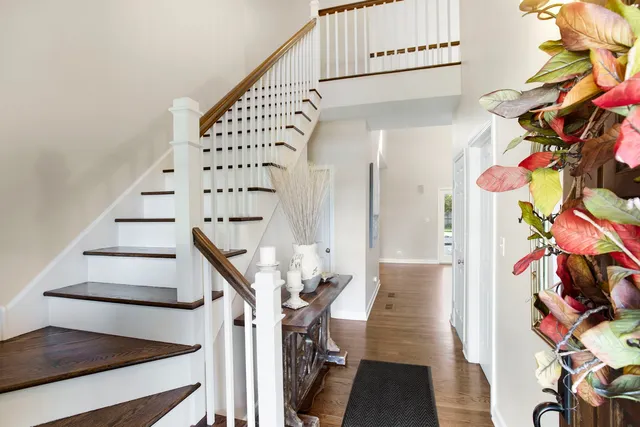 a view of entryway livingroom and hallway with wooden floor