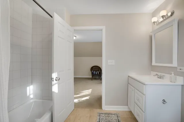 a bed room with a bed and a window